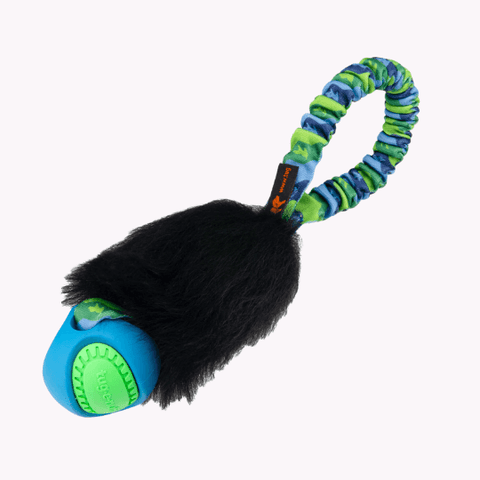 Leke i lommestørrelse med giftfri ball, sort saueskkinn og grønt strikkhåndtak