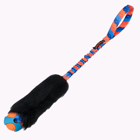 Draleke med sort saueskinn, giftfri ball og polstret oransje håndtak med strikk.